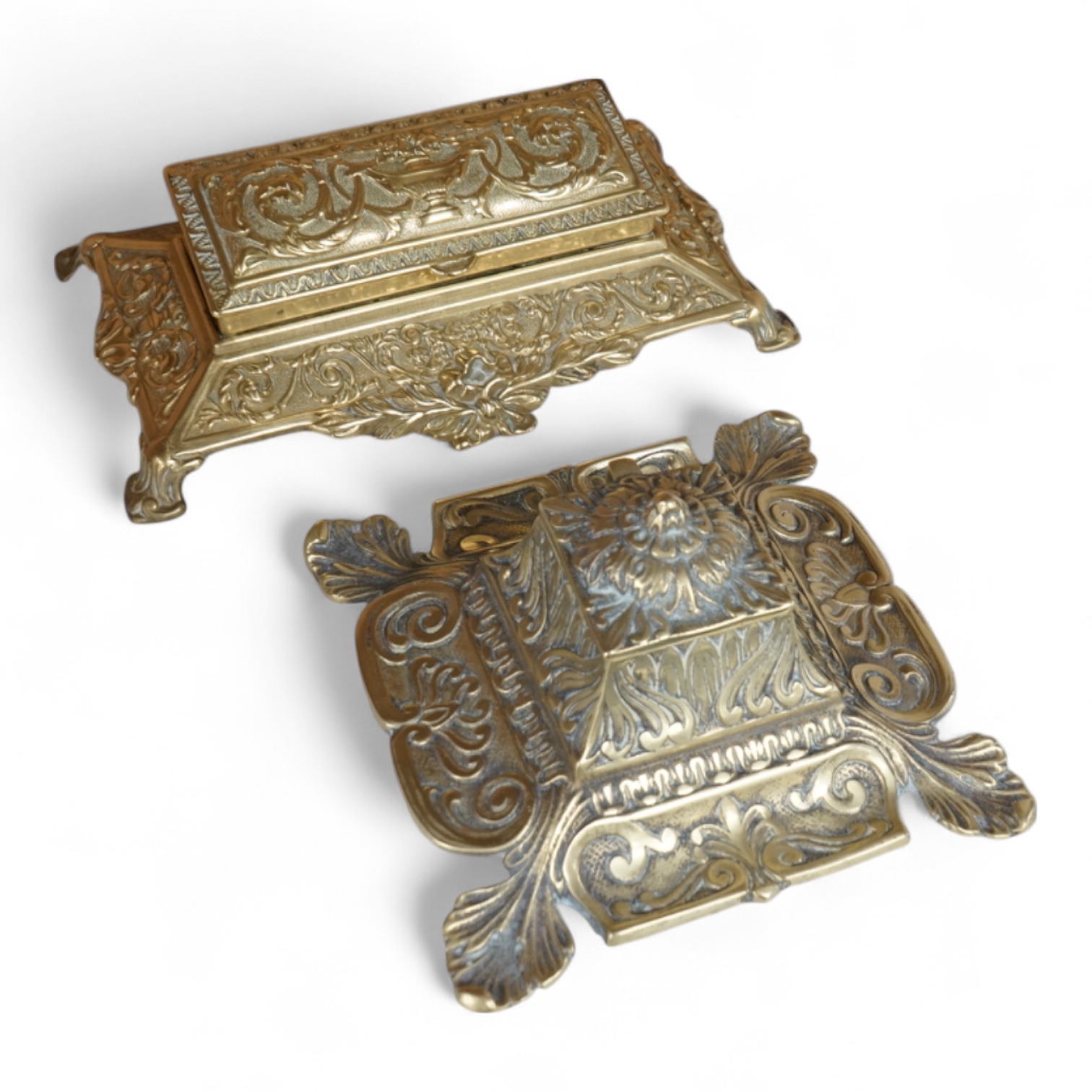A decorative brass stamp box and a similar inkwell, largest 22cm wide